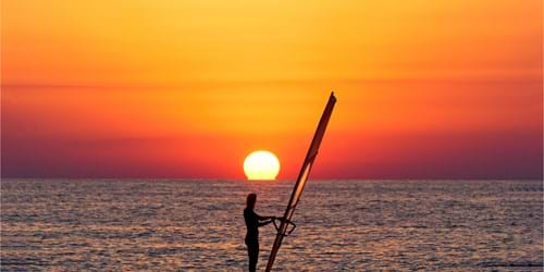 Windsurfing in Greece, sunset